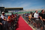Fans lIne the drivers red carpet